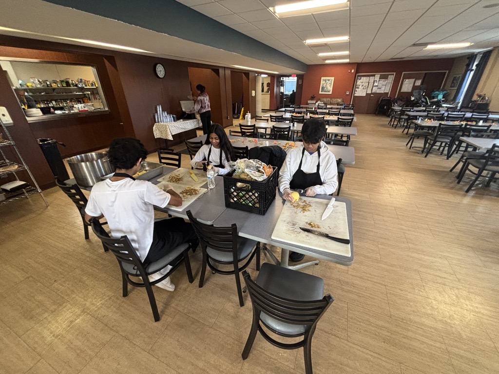 Preparing meals at Grace Center of Hope