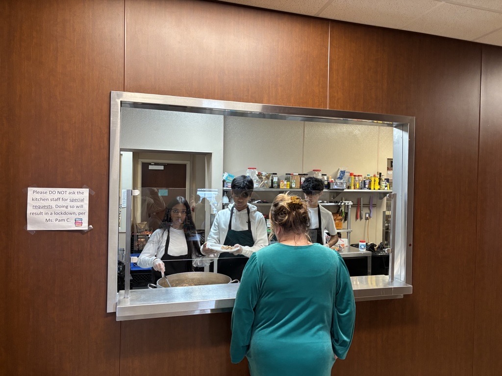 Serving food at Grace Center of Hope