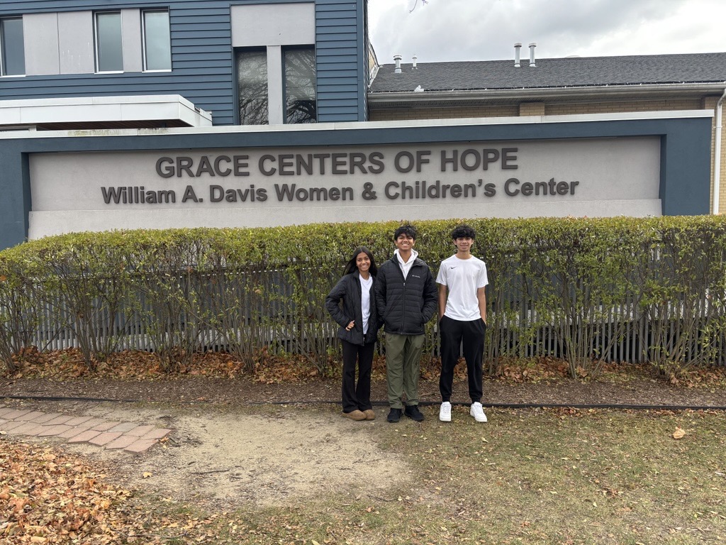 Volunteers serving meals at Grace Center of Hope