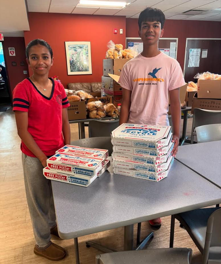 Delivering pizza donations to Grace Center of Hope