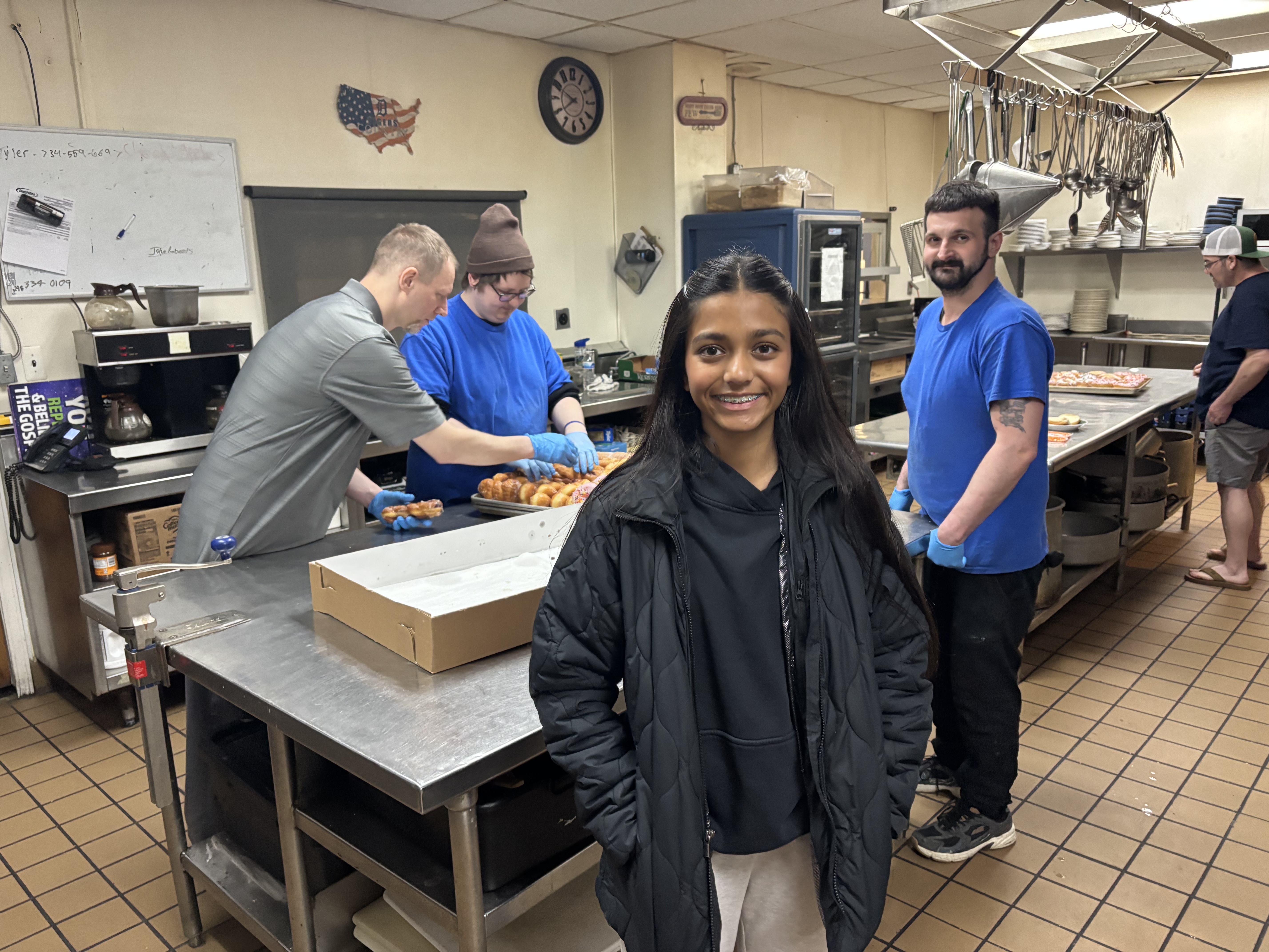 Donut Chef team preparing donuts for donation