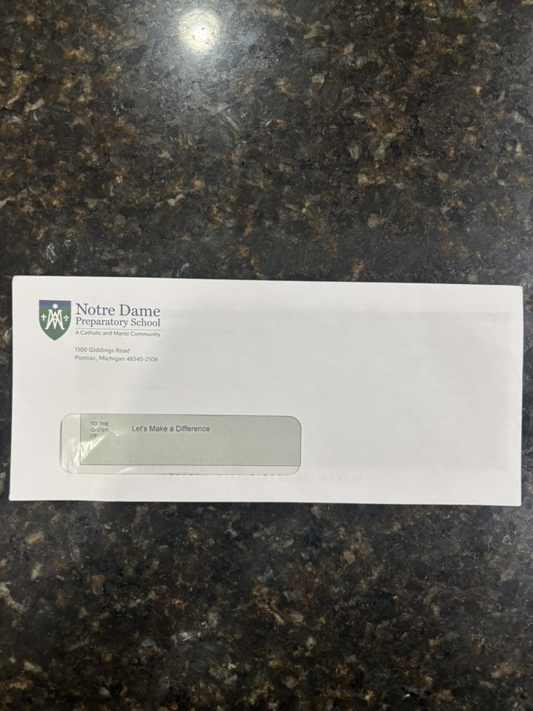 Donation envelope from Notre Dame Preparatory School addressed to Let's Make A Difference